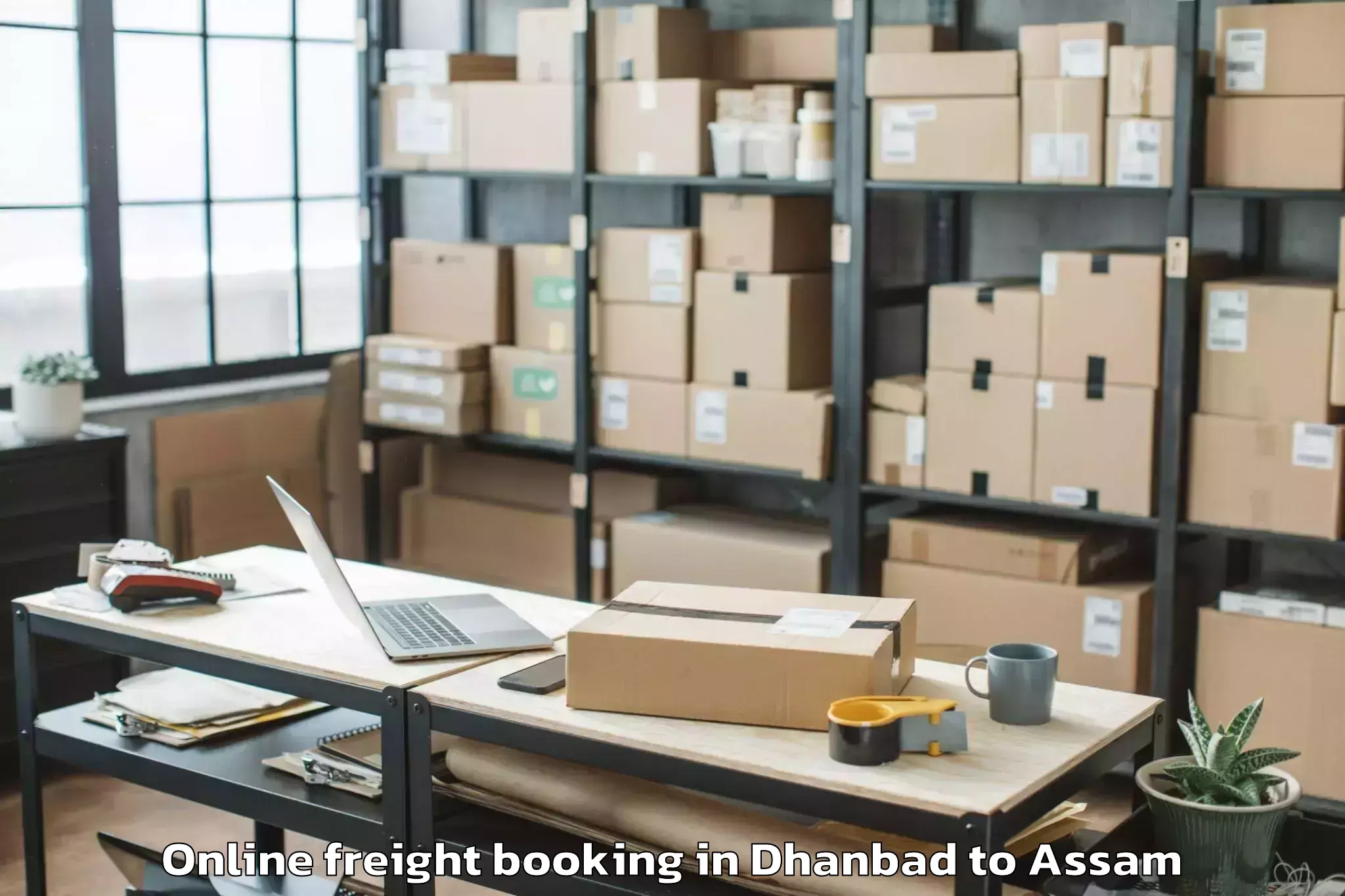 Top Dhanbad to Chaparmukh Online Freight Booking Available